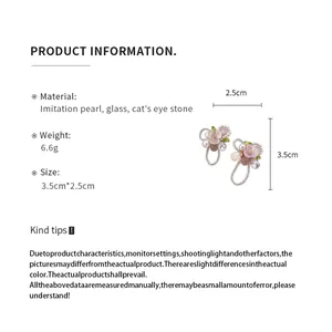 Detailed specifications of flower stud earrings with pearl and cat's eye stone measurements.