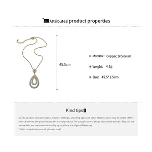 Detail view of gold teardrop pendant necklace with zirconium stones and product specs.