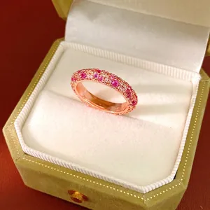 Elegant rose gold eternity ring with pink and clear zircons presented in a velvet gift box