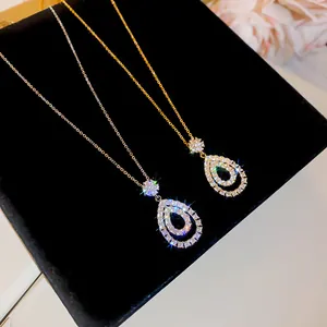 Detail view of shimmering teardrop pendant necklaces with elegant cubic zirconia crystals