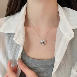 Elegant minimalist silver beaded heart pendant necklace on a delicate clavicle chain