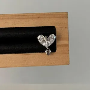 Elegant 18K gold plated heart ear clip featuring sparkling zirconia stones and cross detail