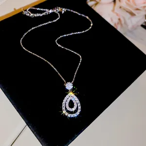 Exquisite detail shot of sparkling zircon teardrop pendant necklace with fine silver chain