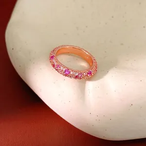 Elegant rose gold ring featuring sparkling pink and white cubic zirconia stones