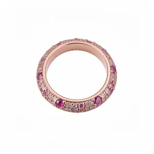 Elegant rose gold eternity ring with pink and white zircon stones on white background