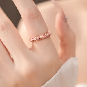 Macro view of a elegant rose gold ring featuring pink and white sparkling cubic zirconia
