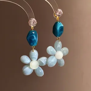 Elegant blue and white resin flower dangle earrings with sparkling zircon accents