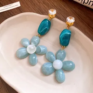 Elegant resin flower dangle earrings with zircons and silver needles for women.