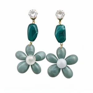 Elegant zircon and green resin flower pendant earrings for women on a clean white background