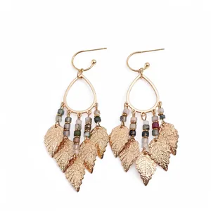 Ethnic style metallic teardrop earrings featuring colorful stone beads and gold leaf tassels
