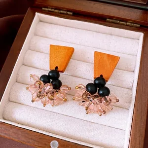 Ethnic style vintage earrings featuring wooden tops and pink glass bead tassels in a gift box