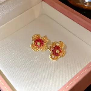 Detailed view of vintage gradient flower stud earrings presented in a pink gift box