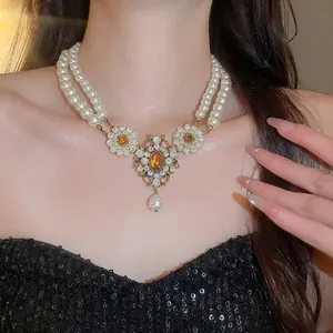 Vintage French luxury multi-layer pearl necklace with a royal palace style pendant ornament