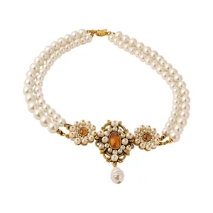 Vintage French style multi-layer pearl necklace with ornate gold pendant and amber stones