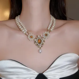 Exquisite detail of a vintage French palace-style multi-layer pearl necklace on a model
