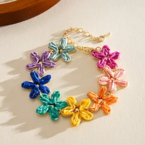Detailed macro view of a colorful raffia flower bracelet in sweet summer style vibe