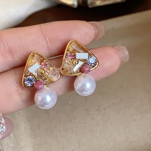 Elegant 18k gold plated vintage triangle crystal stud earrings with dangling white pearls.