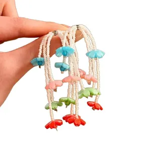 Elegant handmade colorful floral beaded tassel earrings with bohemian vacation style design