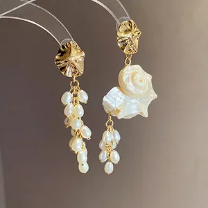 Vintage French style asymmetrical shell and pearl tassel earrings with gold accents