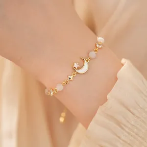 Elegant gold moon and star bracelet with cat eye stone beads and zircon accents