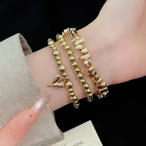 Elegante set di braccialetti vintage con perline dorate e ciondolo a cuore da donna