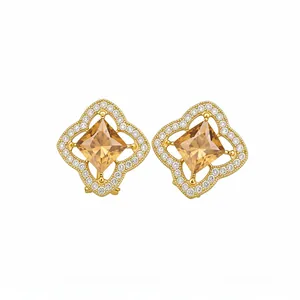 Elegant gold-plated stud earrings featuring a square amber gemstone and pavé crystal frame