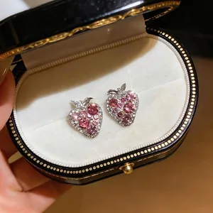 Elegant strawberry shaped stud earrings with sparkling pink crystals in a luxury box