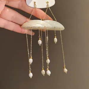 Elegant shell and freshwater pearl tassel earrings with silver needles and gold chains