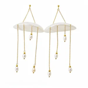 Elegant shell and freshwater pearl tassel earrings with gold chain for a vacation look