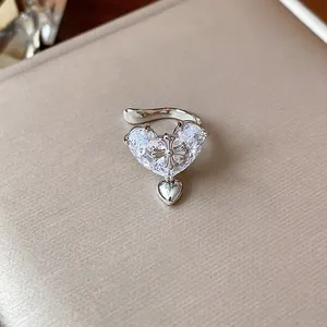 Detail view of 18k gold plated heart zircon ear cuff with cross motif