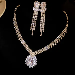 Detail of sparkling cubic zirconia necklace and tassel drop earrings jewelry set