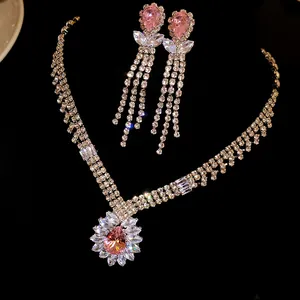 Luxury close-up of a pink pear-shaped zircon necklace and earrings jewelry set for women
