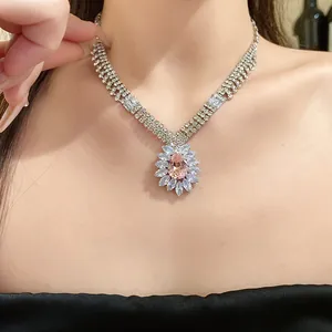 Detailed view of a teardrop crystal pendant necklace with zircon accents.