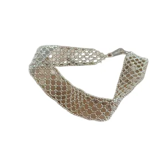 Minimalist hollow mesh cross bracelet in silver finish for a sophisticated modern look