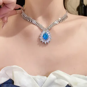 Elegant blue teardrop pendant necklace with sparkling clear zirconia stones for women