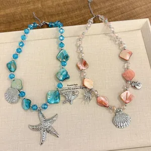 Sea-themed beach necklace set with colorful irregular beads and starfish shell pendants.