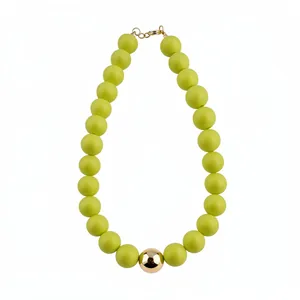 Exaggerated necklace with matte green large beads and a central polished gold sphere