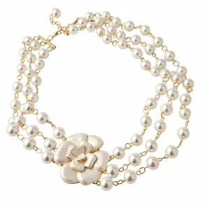 Vintage style multi-strand faux pearl necklace with large white enamel camellia