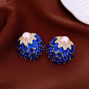 Vintage palace style pearl stud earrings with blue gemstones and crystal accents