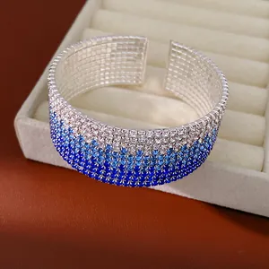 Elegant multi-row gradient rhinestone stretch cuff bracelet featuring sparkling blue stones