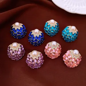 Retro court style round pearl stud earrings with colorful crystals on brown velvet