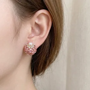 Vintage style pearl stud earrings with pink gemstones and sparkling crystal accents
