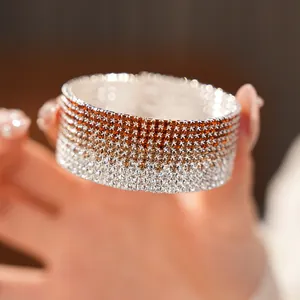 Macro view of multi-layer gradient rhinestone elastic bangle with sparkling crystals.