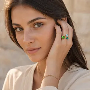 Close-up of an elegant 18K gold plated ring featuring vibrant geometric crystals