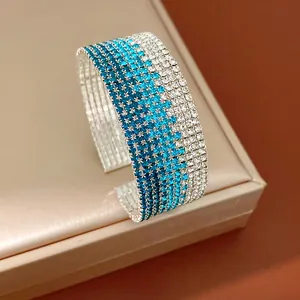 Detail showing the sparkling blue gradient rhinestone texture of this stretch cuff bracelet