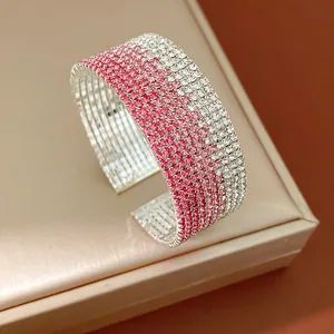 Close-up of elegant gradient pink and silver rhinestone multi-layer open cuff bracelet