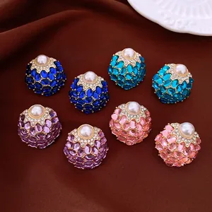 Vintage court style pearl stud earrings with colorful crystals and rhinestones details.