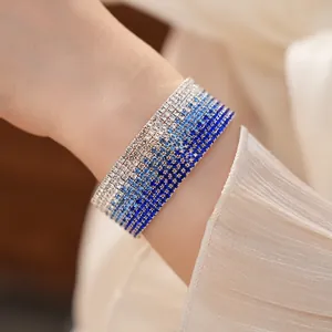 Close-up of an elegant multi-layer rhinestone bracelet with a blue gradient design