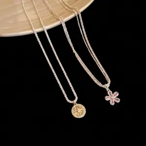 Elegant double-layered silver necklace with zircon flower and star pendants