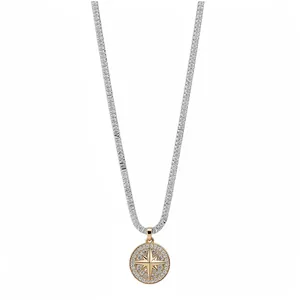 Elegant silver and gold-toned starburst compass pendant necklace with sparkling zircons